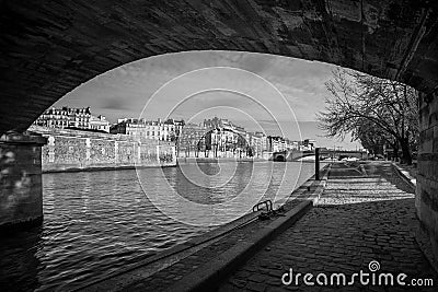 Embankment of the Seine at sunny autumn afternoon warm weather. BW photo. Paris. France Stock Photo