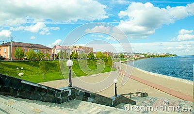Embankment, steps, lanterns, buildings, sky, Volga River. Spring. Stock Photo