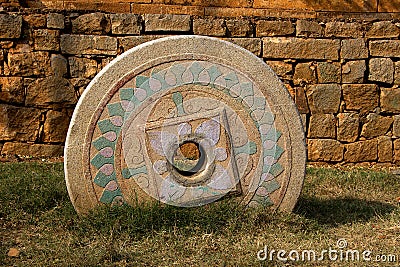 Embedded, Carved Stone Wheel Stock Photo