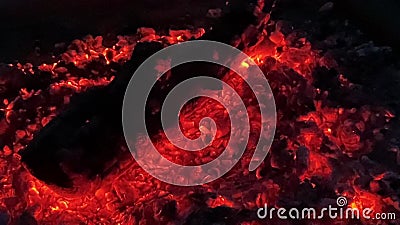 The embers of the campfire. Close-up, danger hot. Campfire background. Fire glow movie stock footage The embers of the campfire. Close-up, danger hot. Campfire background. Fire glow movie stock footage