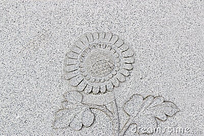 Emboss sunflower on grey wall, horizontal Stock Photo