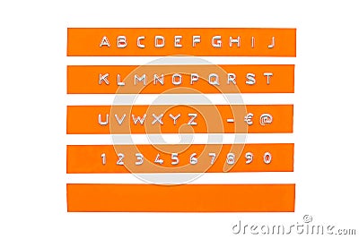 Embossed alphabet on orange plastic tape Stock Photo
