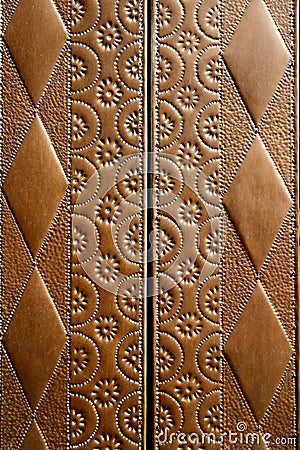 Embossed brass vintage old church door detail Stock Photo