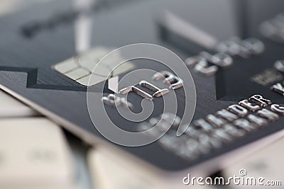 Embossed chipped credit card lying on silver keyboard Editorial Stock Photo