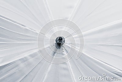 Embossed white background, white umbrella Stock Photo