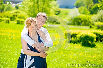 Embrace of the man she loved and future dads Stock Photo