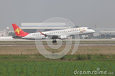 A embraer 190 landing on the runway Editorial Stock Photo