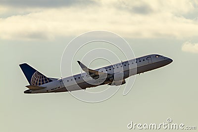 An Embraer 175LR model passenger airplane operated by United Airlines Editorial Stock Photo