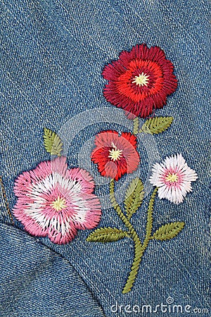 Embroider flower on jeans Stock Photo