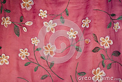 Embroidered Flowers on Pink Silk Stock Photo