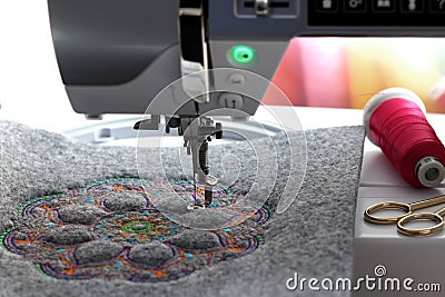 embroidery of colorful mandala on felt with embroidery machine - front view Stock Photo