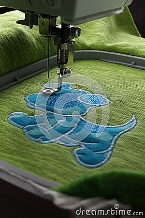 Embroidery with embroidery machine - comic dog application - overview intermediate status Stock Photo