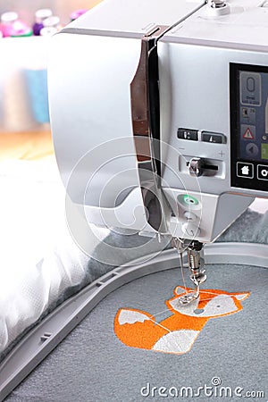 Embroidery with embroidery machine - fox theme - portrait orienataion Stock Photo