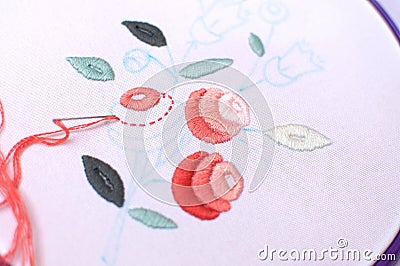 Embroidery with floral motif framed in a hoop. Work in process. Stock Photo