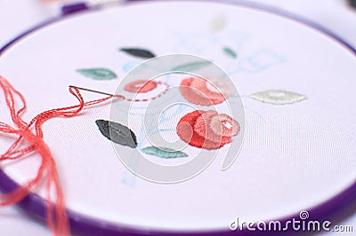 Embroidery with floral motif framed in a hoop. Work in process. Stock Photo