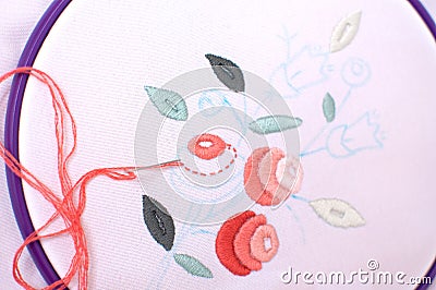 Embroidery with floral motif framed in a hoop. Work in process. Stock Photo