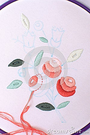 Embroidery with floral motif framed in a hoop. Work in process. Stock Photo