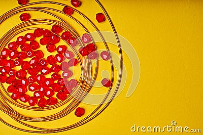 Embroidery products and tools. Embroidery thread and red roundels on yellow background Stock Photo