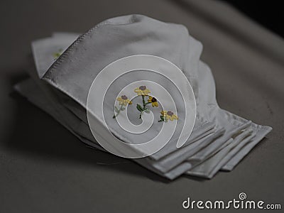 Embroidery stick flower pattern on Fabric Face mask protective against during the dust PM 2.5, coronavirus Epidemic, virus covid- Stock Photo