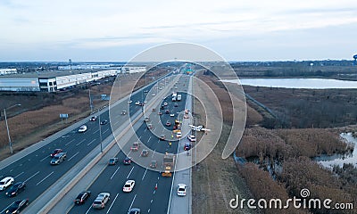 Emergency airplane landing on highway. Drone wide shot Stock Photo