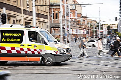 New South Wales Emergency Ambulance on George Street Haymarket Chinatown.The image was taken in panning shot. Editorial Stock Photo