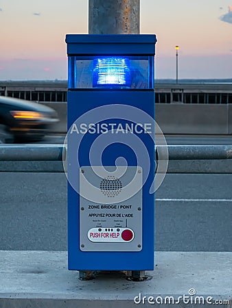 Emergency assistance phone on a bridge, dusk Stock Photo