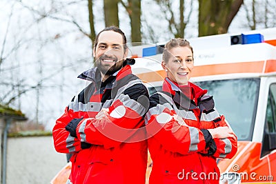 Emergency doctor in front of ambulance car Stock Photo