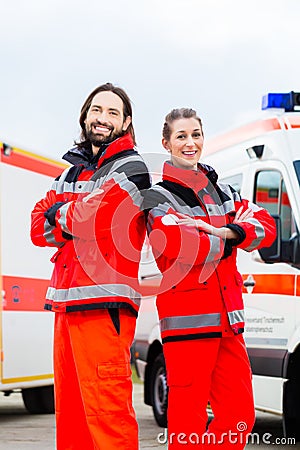 Emergency doctor and paramedic with ambulance Stock Photo