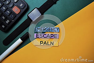 Emergency Escape Plan text on top view color table background Stock Photo