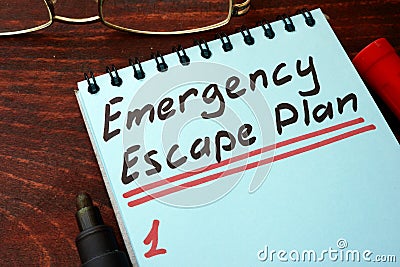 Emergency Escape Plan written on a notepad. Stock Photo