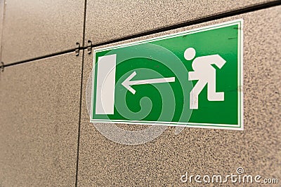 Emergency Evacuation Sign On Wall Stock Photo