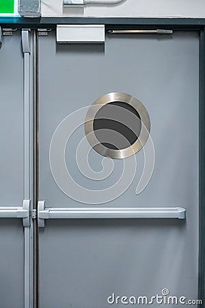 Emergency Exit Door with circle preview window Stock Photo