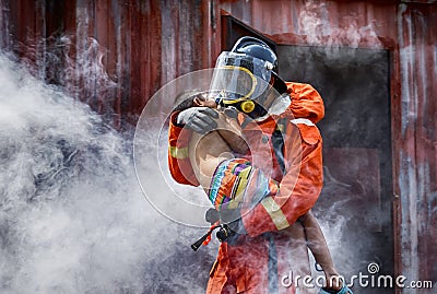 Emergency Fire Rescue training, Firefighters save the boy from bu Stock Photo