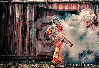 Emergency Fire Rescue training,Firefighters save the boy from bu Stock Photo