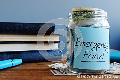 Emergency fund written on a jar with money Stock Photo