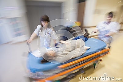 Emergency Hospital Nurses Pushing Litter Patient Stock Photo