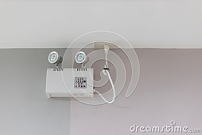 Emergency lights with two lamps.emergency light auto lighting working when power outage by battery. Stock Photo