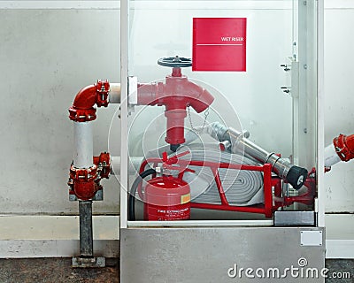 Emergency security kit - fire hydrant, water supply valve, fire extinguisher in a glass box Stock Photo