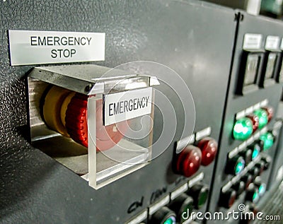 Emergency stop button at control panel Stock Photo