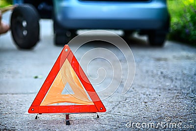 Emergency stop sign in backround with broken down car Stock Photo