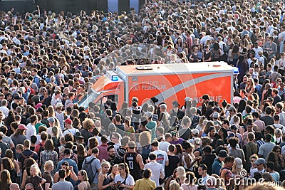 Emergency transporter / ambulance inside crowd of people Editorial Stock Photo