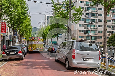 Emergency vehicle on crowed city street Editorial Stock Photo