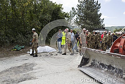 Emergency workers with bulldozer after earthquake in Pescara del Tronto, Italy Editorial Stock Photo