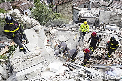 Emergency workers in earthquake damage, Pescara del Tronto, Italy Editorial Stock Photo