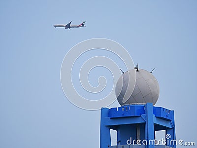 Emirates plane flying above meteorological radar in Curepipe, Mauritius Editorial Stock Photo