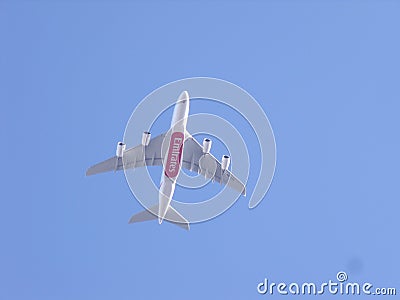 Emirates plane flying overhead Editorial Stock Photo