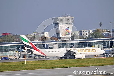 Emirates plane on the Warsaw Chopin Airport Editorial Stock Photo