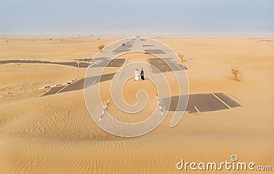 Emirati couple in a desert Stock Photo