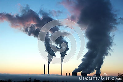 Emission from coal powerplant during the sunset Stock Photo