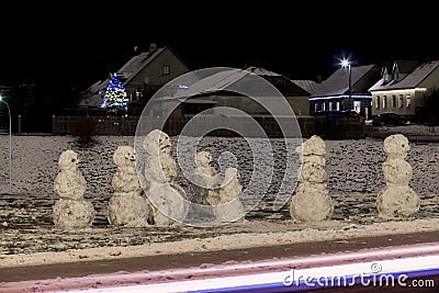 Emocional snowman`s family at december night Stock Photo
